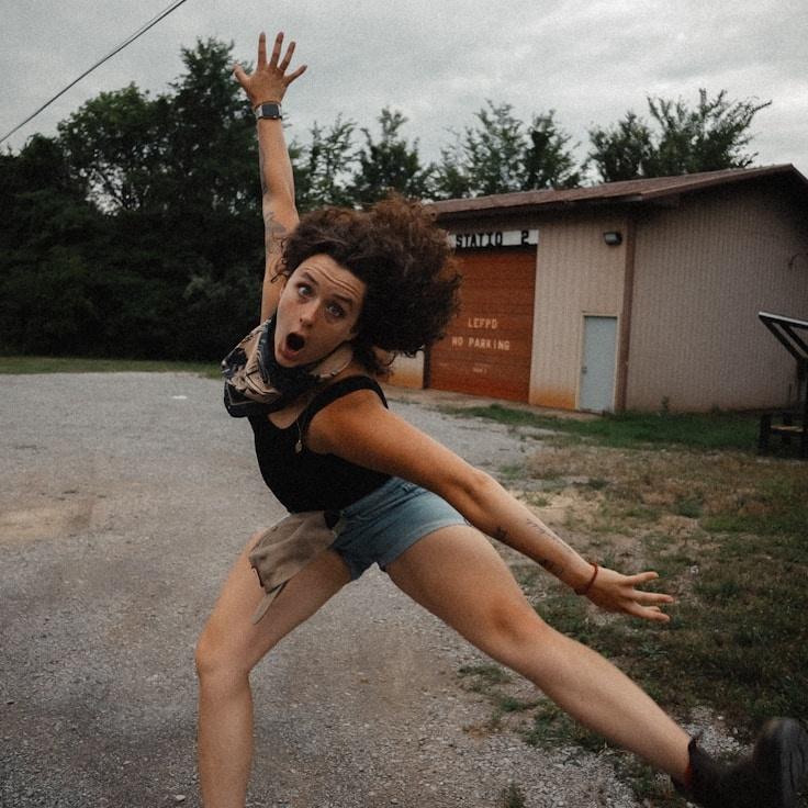 Kaveri Mehta, Lead Design Curator at LumenLanternWatch, reviewing corporate floral arrangements